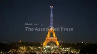 Eiffel Tower lit up in the colours of the Ukrainian flag