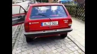 Girl cranking old VW Polo Fox