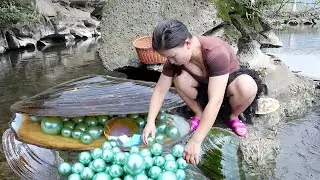 Nature's Oddity, Girl's Delight: Mutant River Mussel Conceals Stunning Pearl for Explorer!