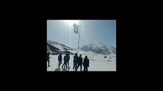 Patriotic Pakistani youth hoisting the national flag