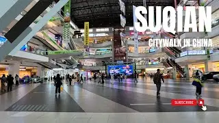 Walk from Youth Road in Suqian City to Baolong City Shopping Plaza.
