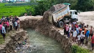 Start Opening New Project!!Bulldozer KOMAT'SU D31P pushing Soil into flooded​ & Trucks 8Ton.