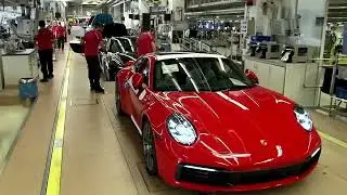 Porsche warns restructuring, trade tensions to hit year ahead | REUTERS