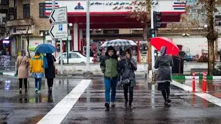 Walking in the rain, downtown Tehran