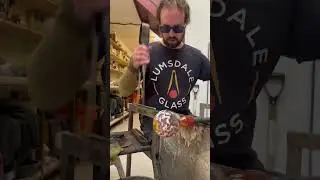 Glass artist is making handblown glasses in the colors of a local football team!