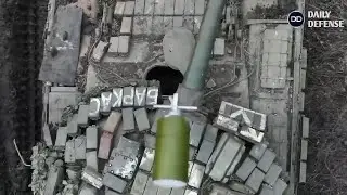 Ukrainian drone drops bomb into Russian tank open hatch causing it to Fire