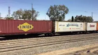 A pacific national superfreighter and the Indian pacific at broken hill