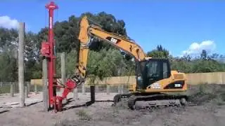 Pile Driving with Cat 312DL Excavator in New Zealand.
