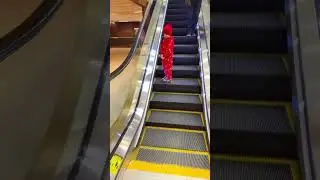 Cute tiny kid with small feet and big journey on #escalator❤️