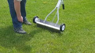 Ecko magnetic sweeper picking up nails in grass