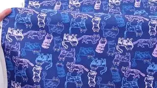 navy fabric with cats in blue and purple by Dear Stella
