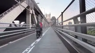 Bicycles riding over the 59 street bridge on bike lanes from Queen to NYC