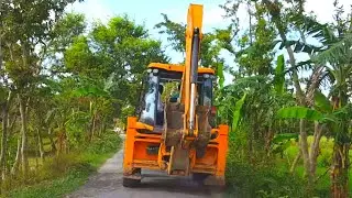 Following JCB Backhoe Passing through a Tranquil Village - JCB - JCB Video - Off RoadPlanet