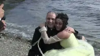Bride walks into the sea in full wedding dress during beach photoshoot.