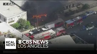 Firefighters work to put out Koreatown house fire