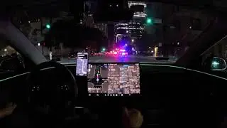 Tesla FSD 14.2.2.2 responds perfectly to police emergency vehicles on New Year's Eve!