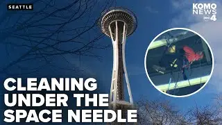 Dangerous jobs: Worker cleans bottom windows of Seattle Space Needle