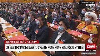 China approves electoral reform to ensure 
