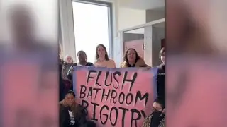 &lsquo;Bullying tactics&rsquo;: Transgender activists storm women&rsquo;s bathroom to protest