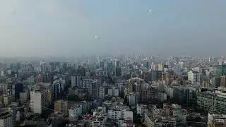 Vast aerial panorama of the Lima cityscape in Peru, showing dense buildings and modern skyscrapers