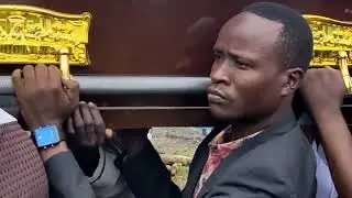 THE BODY OF PASTOR JOSEPH BEING CARRIED BY A TEAM OF YOUNG PASTORS FROM KITGUM TO THE BURIAL SITE 