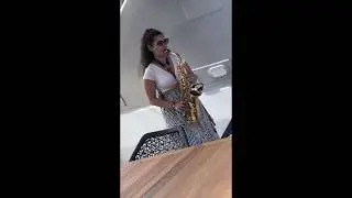 Female saxophone player yacht privet event