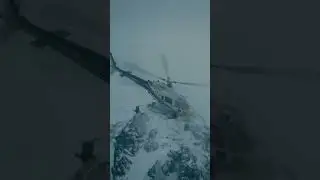 A small tourist helicopter crashes into a fog-covered mountain, dramatic moment captured