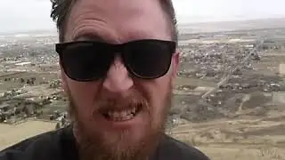 Windy Hike up Face of Mountain