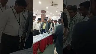 YHAI National Chairman Sri Manoj Johra watching LIMCA RECORD COINS at Bhimavaram