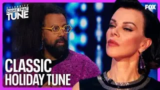 Do Reggie Watts & Debi Mazar Know Their Christmas Classics? | Celebrity Name That Tune
