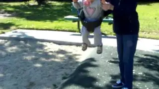 Francesca enjoying the swings.