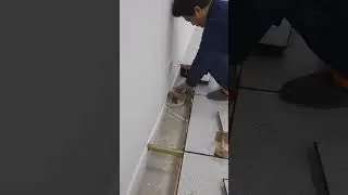 Workers use our anti-static raised floor to install the wall border.  #raisedfloor #titanflor