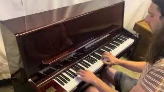 Quality Korean Samick compact piano in a polished mahogany case.