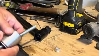Replacing a lower control arm bushing in Polaris 450HO ATV