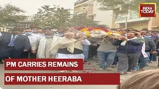 PM Narendra Modi Carries The Mortal Remains Of His Late Mother Heeraba