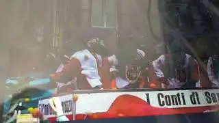 Italian people throwing oranges at people