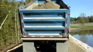 Dump truck spreading stone