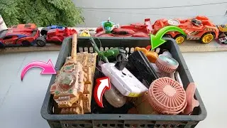 Opening up a pile of old stuff | found lots of quirky mini fans, toys, and vintage electronics.
