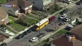 Child Dies After Being Pinned Between School Bus, Van