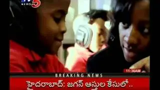 TV5 - E News - School-going children in Singapore carry iPads to school