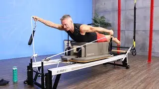 Surfer on Long Box on the Pilates Reformer