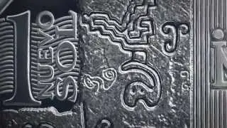 Moneda de un nuevo sol alusiva a los Petroglifos de Pusharo