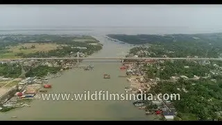 Bird's eye view of Namkhana bridge over Hatania-Doyania River in West Bengal - 4K Aerial