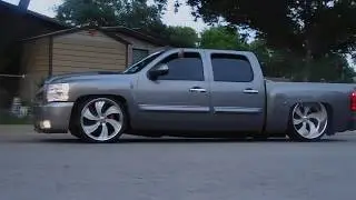 Dropped silverado drive by tucking intro wheels!