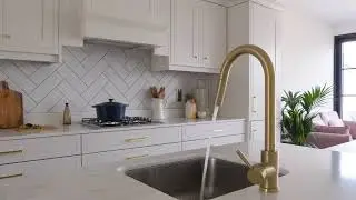 A stunning example of our Hampton Cotton White Kitchen and Dust Grey Island, with a Canova Worktop
