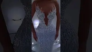 Share with a friend who would own the spotlight in this ice-blue crystal gown! To order, send us a