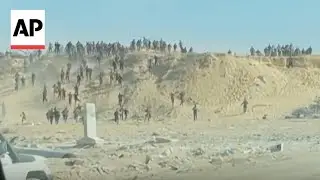 Video shows crowds of Palestinians running towards aid trucks in Gaza