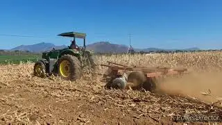 John Deere 6140M discing sweetcorn residue.