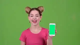Girl advertises the phone green screen footage