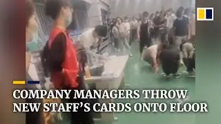 Chinese company managers throw new staff&rsquo;s cards onto floor